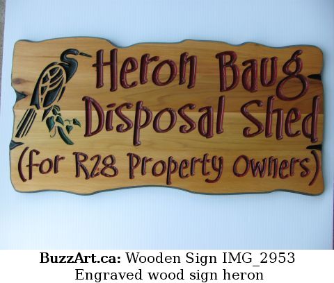 Engraved wood sign heron